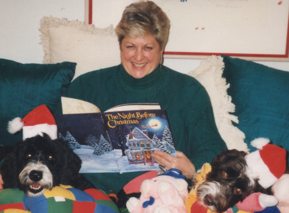 Animal communicator Lauren Grey with stuffed animals and real ones.