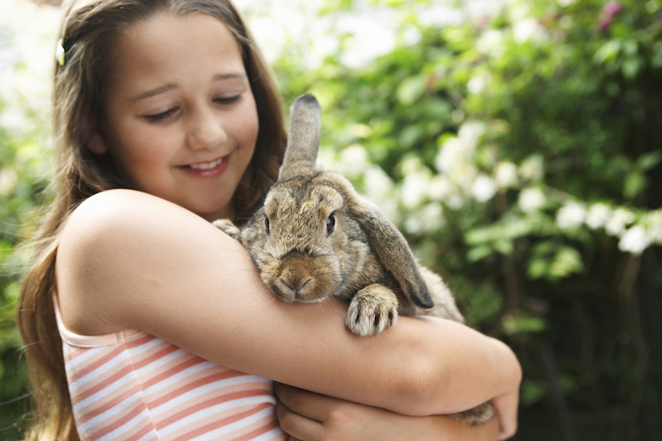 Girl holding her bunny rabbit.